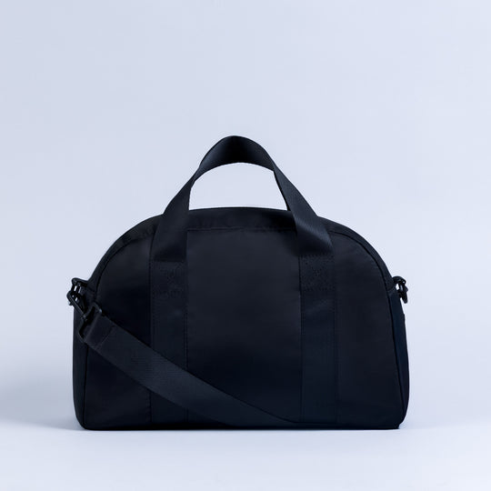 Mini duffle bag with crossbody strap and top carry handles