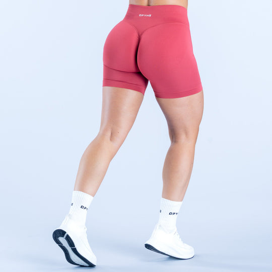 Women's 4.5-inch pink compression shorts, side view