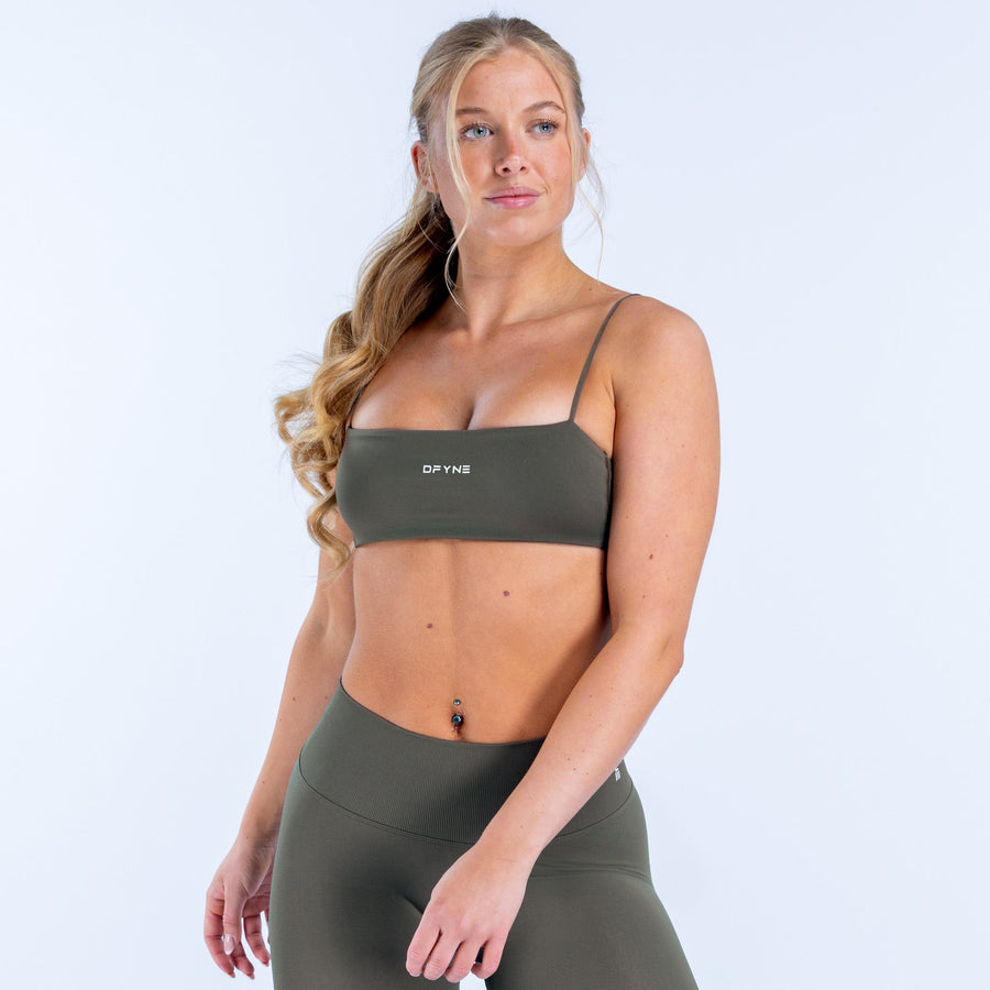 Dark green strappy sports bra with spaghetti straps and DPYN logo