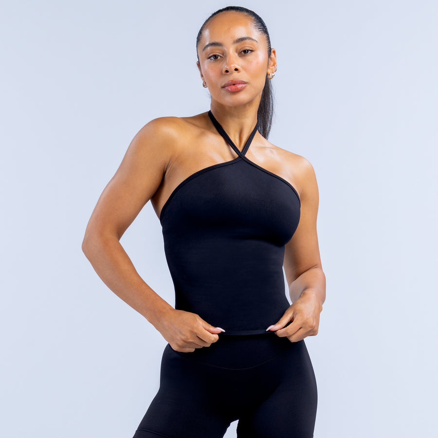 Black longline halter top with crisscross neck straps and fitted stretch knit