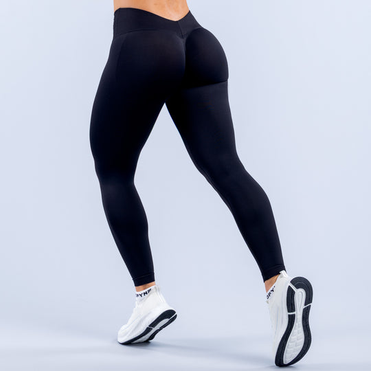 Black high-waist leggings with tapered ankle cuffs and sleek fit