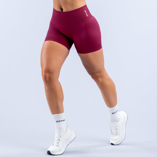 Maroon 4.5-inch athletic shorts with wide waistband and fitted athletic fit