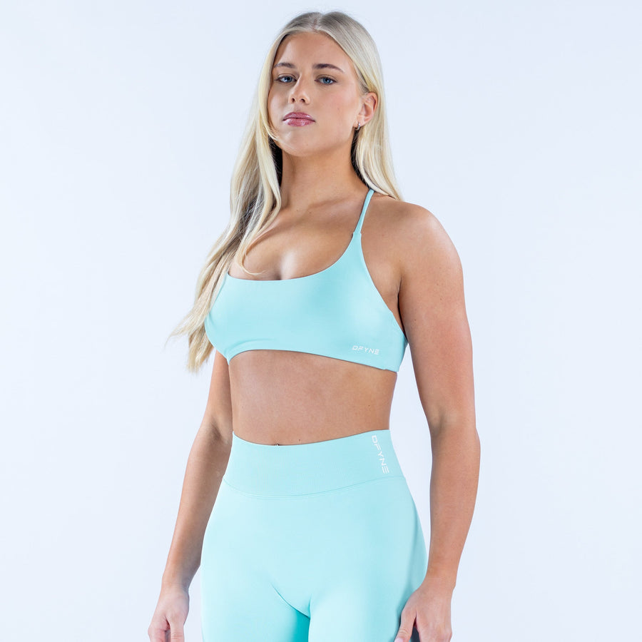 Women's light blue sports bra with smooth scoop neckline and wide underband