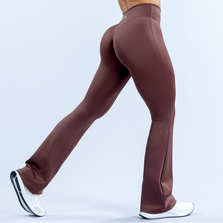 Women's dark maroon flared leggings, back view with smooth seam