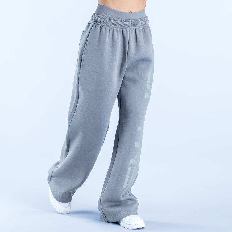 Light gray wide-leg jogger pants with side graphic logo and relaxed cuffed hems