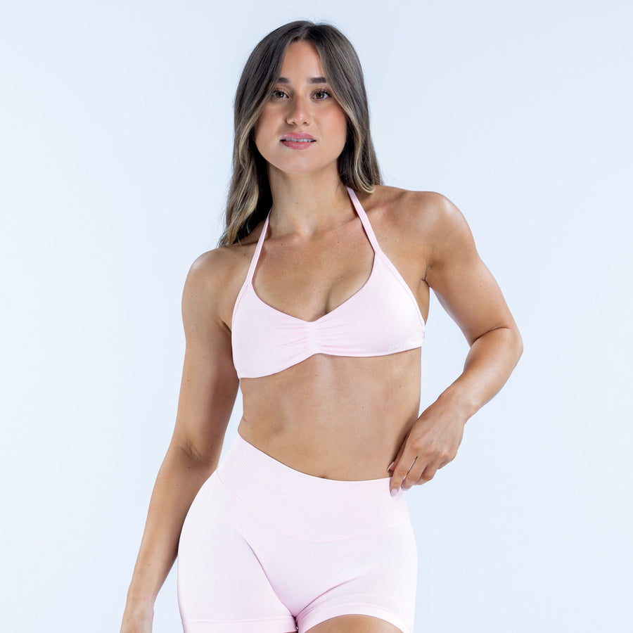 Light pink strappy bra with triangle cups and thin adjustable straps