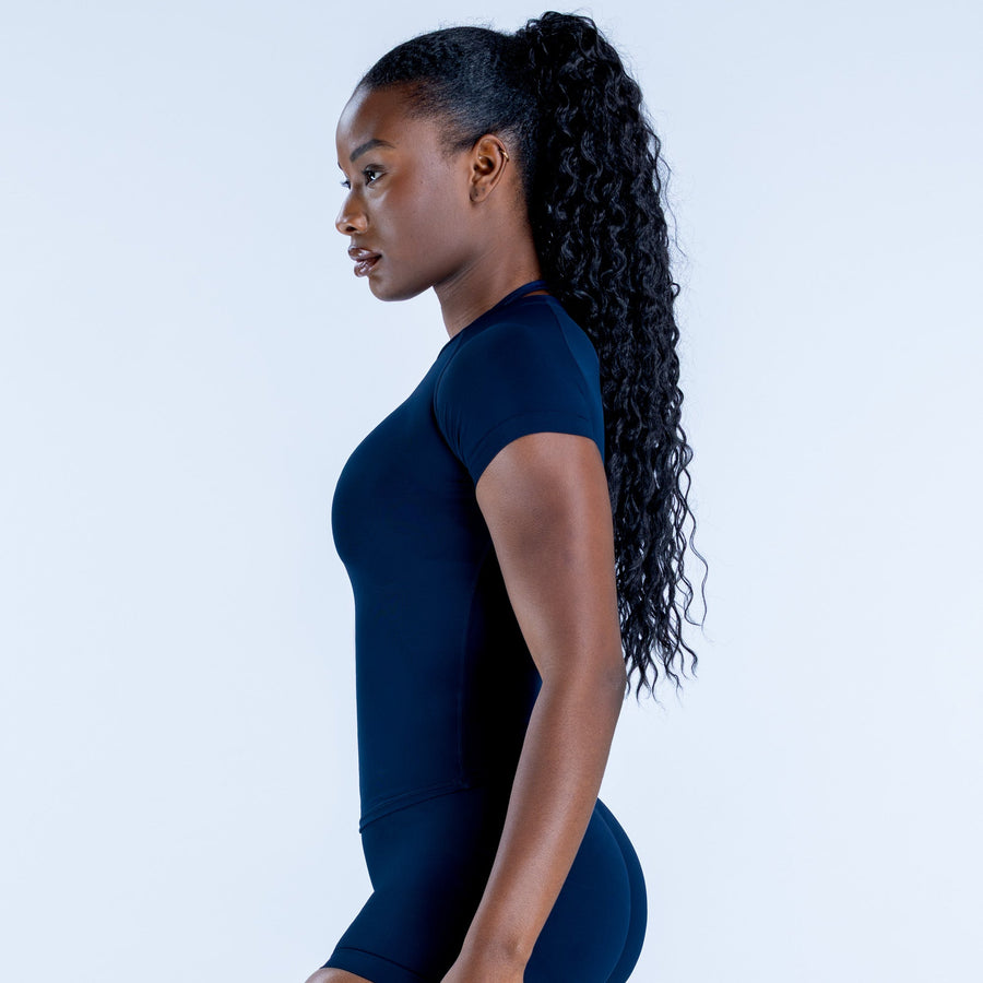 Impact short sleeve top, side profile: dark blue fitted top with short sleeves