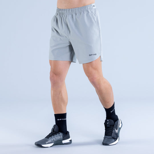 Men's light blue training shorts with elastic waist and DPYNE logo, side view