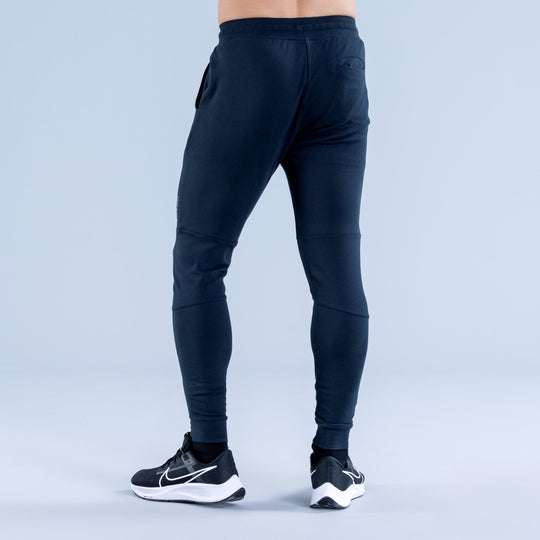 Dark navy tapered jogger pants with side pocket and elastic ankle cuffs