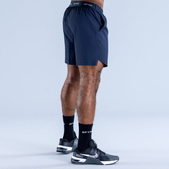 Navy training shorts with elastic waistband and straight hem, back view