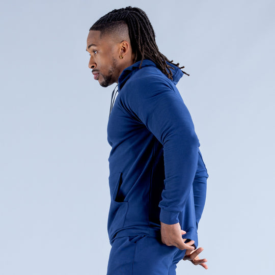 Royal blue hoodie side view with drawstring hood and ribbed cuffs
