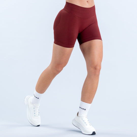 Burgundy 4.5-inch athletic shorts with a high waistband, shown from the front.