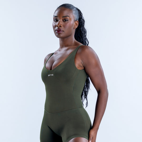 Olive green one-piece romper with a scoop neckline, wide straps, and fitted shorts