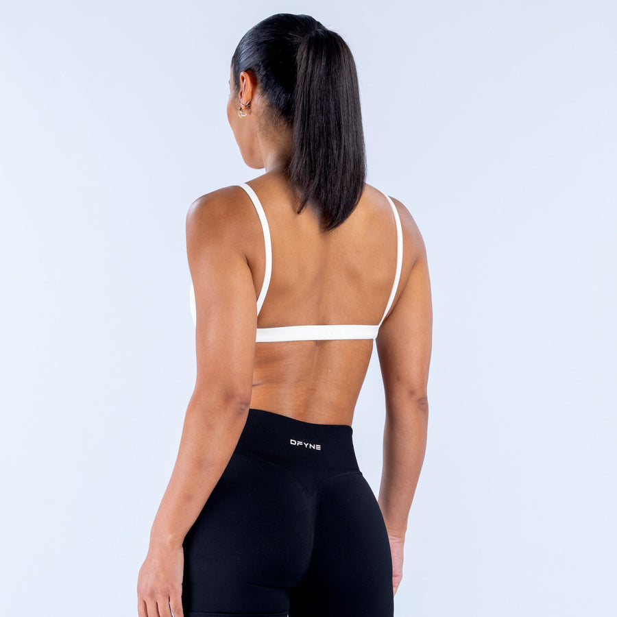 White scoop-neck sports bra back view with thin racer straps