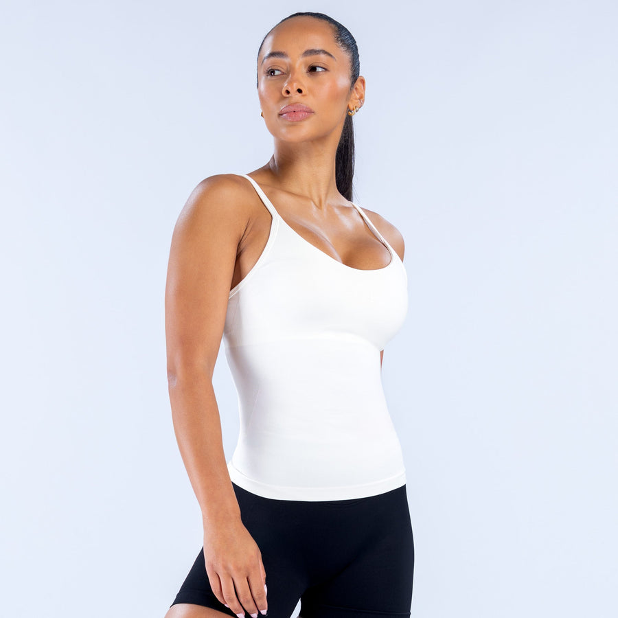 White scoop neck impact top with thin spaghetti straps, hip length fit