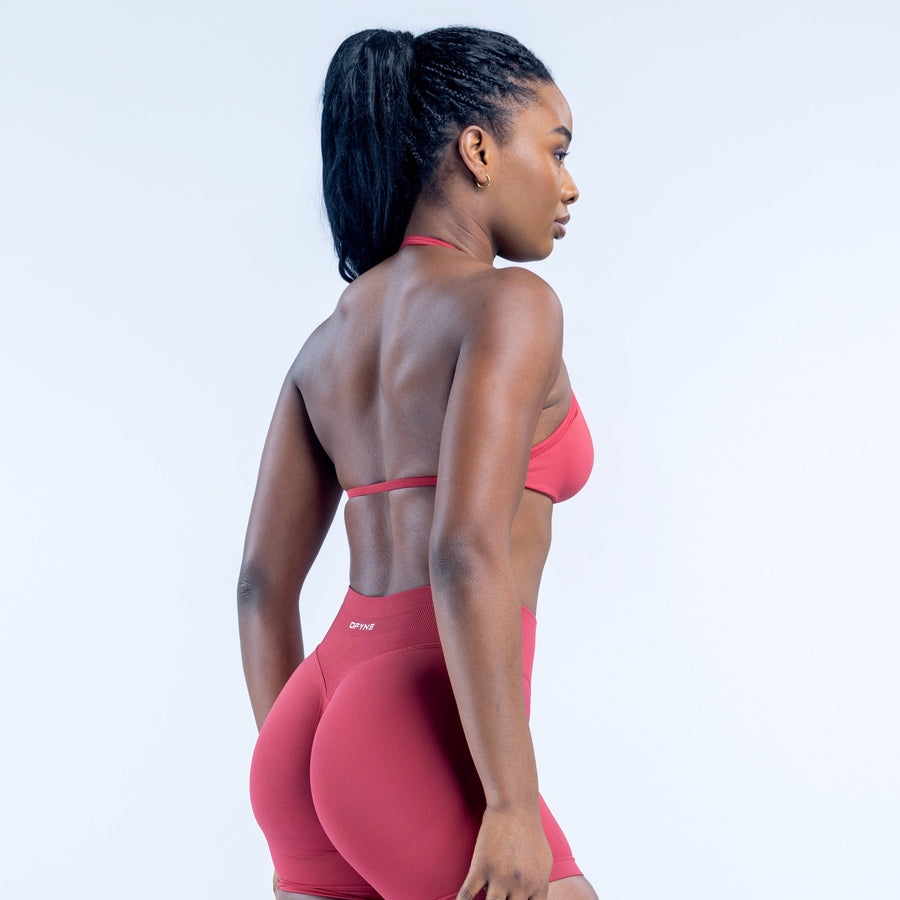 Red strappy back sports bra with crisscross straps and open racerback
