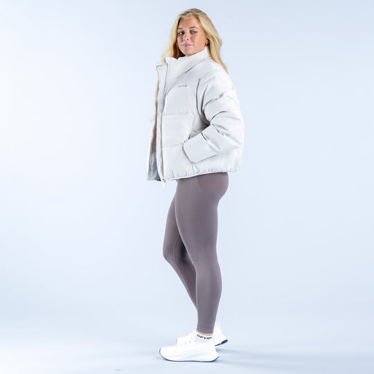 White short down jacket with stand collar and zipper, three-quarter side view