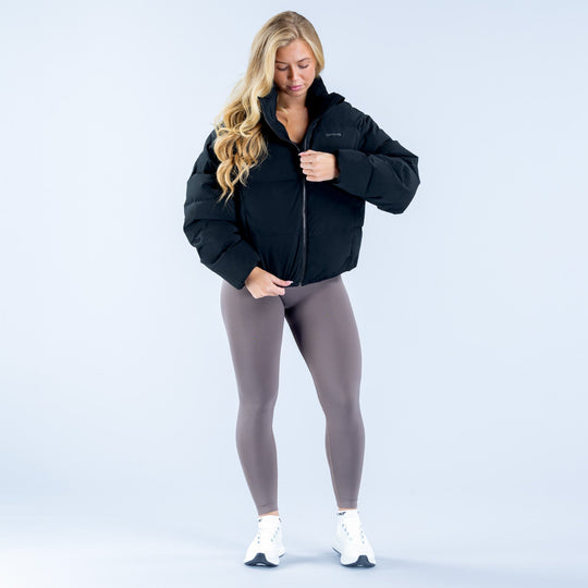 Black short down jacket with zip front, standing collar and padded sleeves