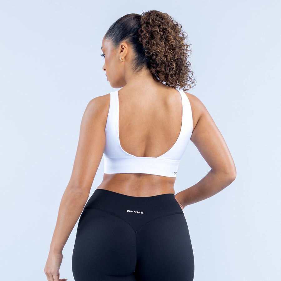 Origin sports bra white back with scooped neckline and racerback straps