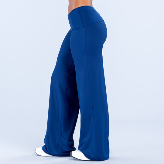 Blue fold-over wide-leg pants, back silhouette with wide flares and smooth waistband