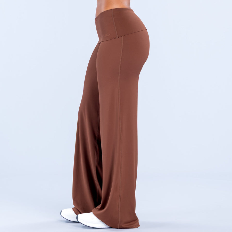 Rust wide-leg pants, folded waist detail and wide straight-leg silhouette