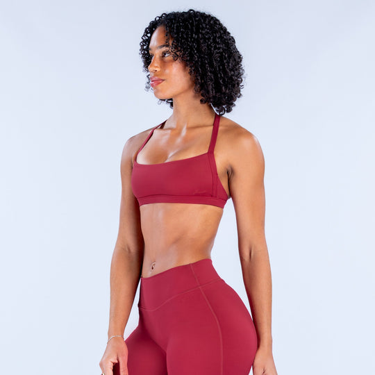 Rugby red sports bra with low scoop front and wide shoulder straps