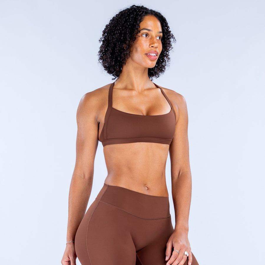 Dark brown sports bra with wide band and scoop front neckline