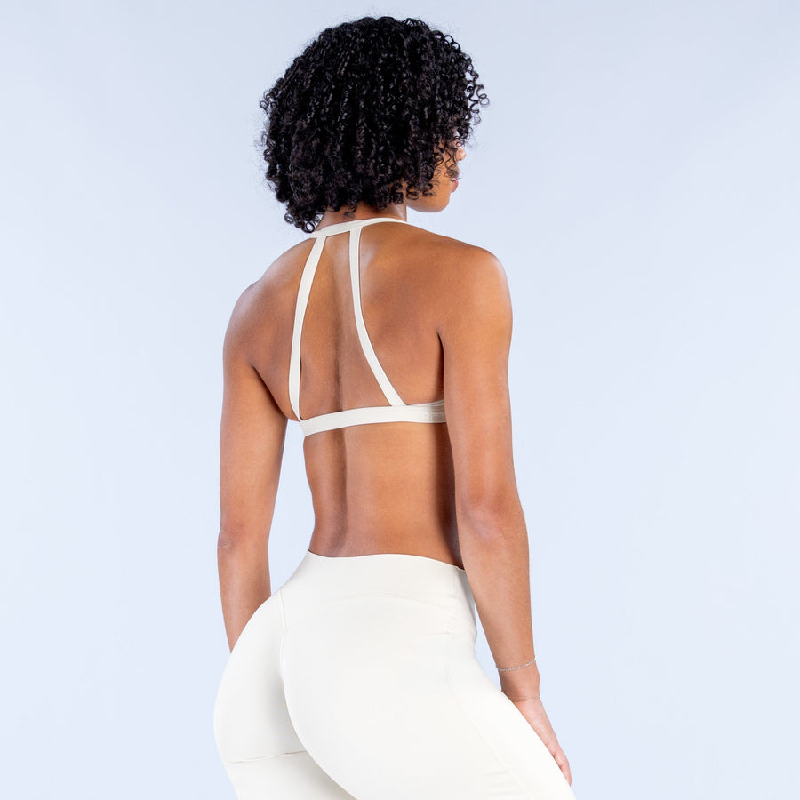 White sports bra with crisscross racer-back straps