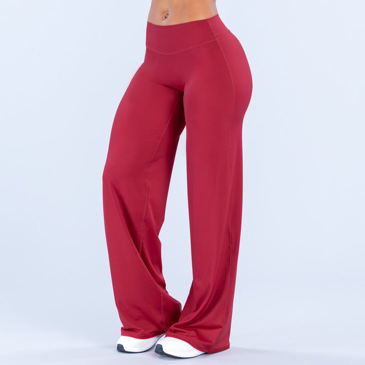 Red wide-leg pants, front three-quarter view, high waist and flowing wide legs