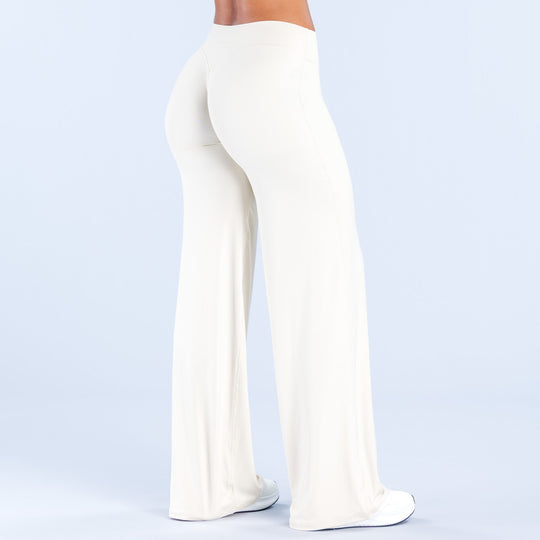 Women's off-white wide-leg pants front three-quarter view with smooth, wide pant legs