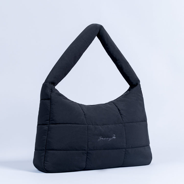 Sav puffer bag in dark quilted fabric, top loop handles
