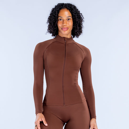 Brown zip-front athletic bodysuit with full-length zipper and long sleeves