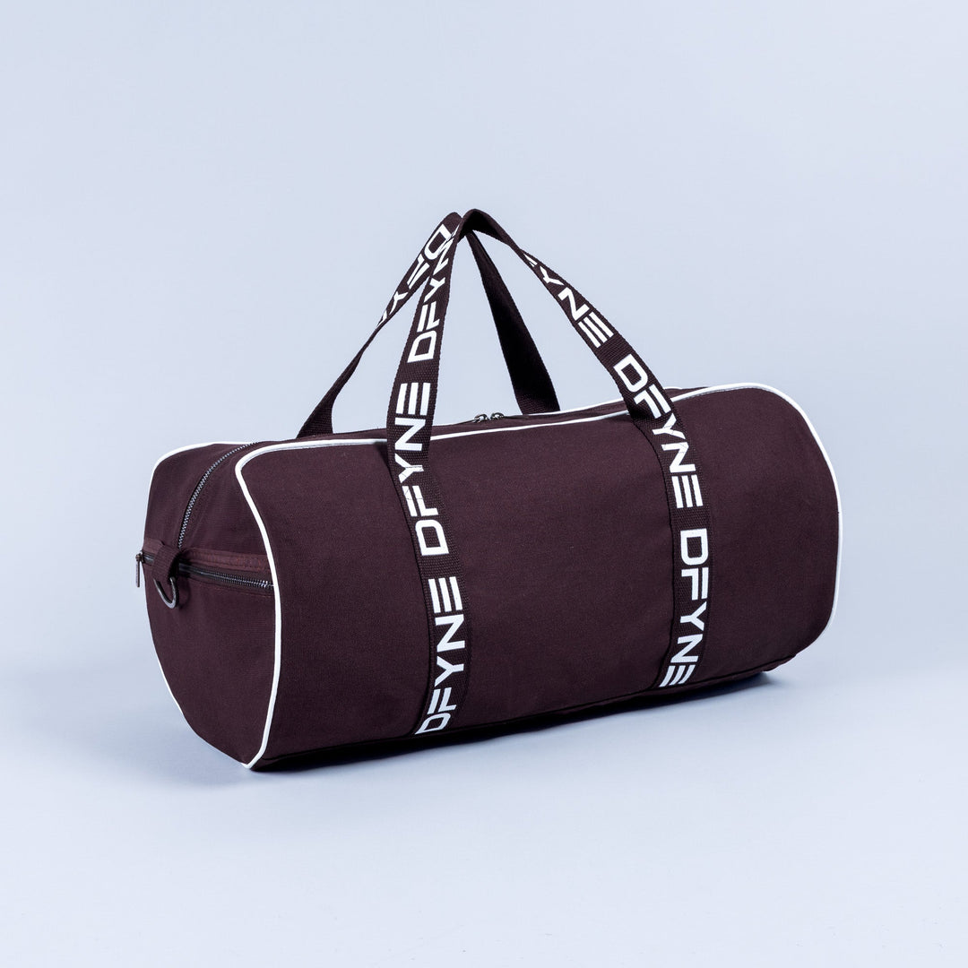 Burgundy duffle bag with white logo webbing straps and front zipper