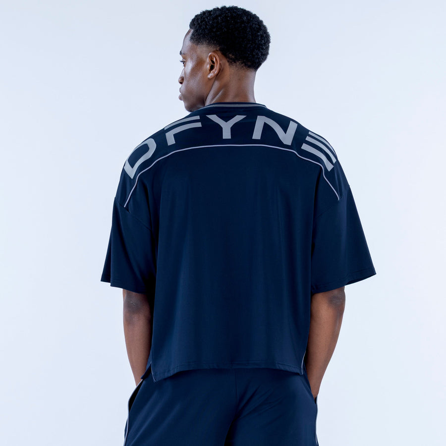 Navy jersey with crew neck, short sleeves, and large white back lettering graphic