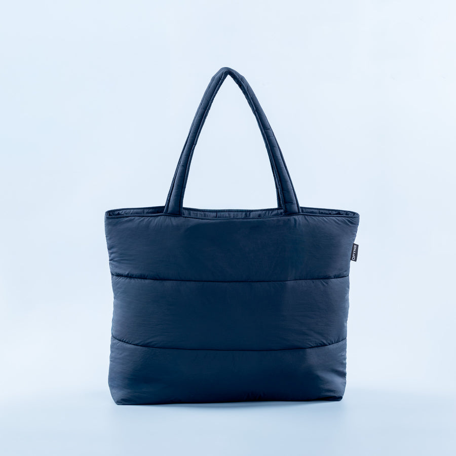 Navy puffer tote bag with wide top handles and side logo patch