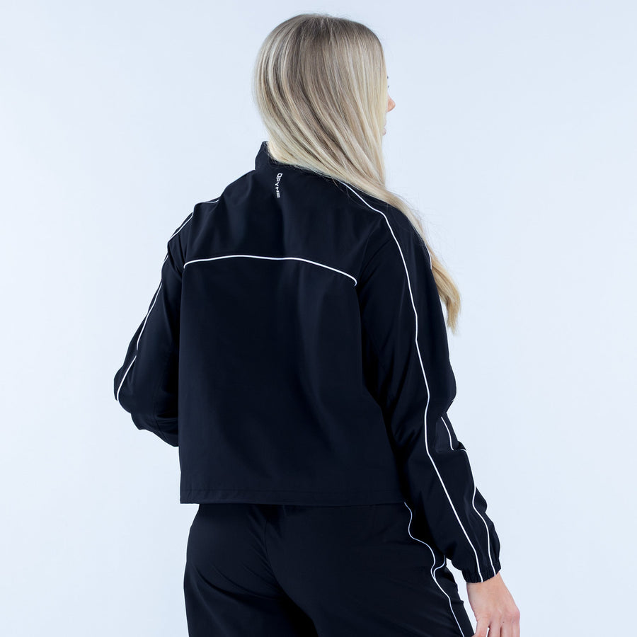 Women's black track jacket back view with white piping along sleeves
