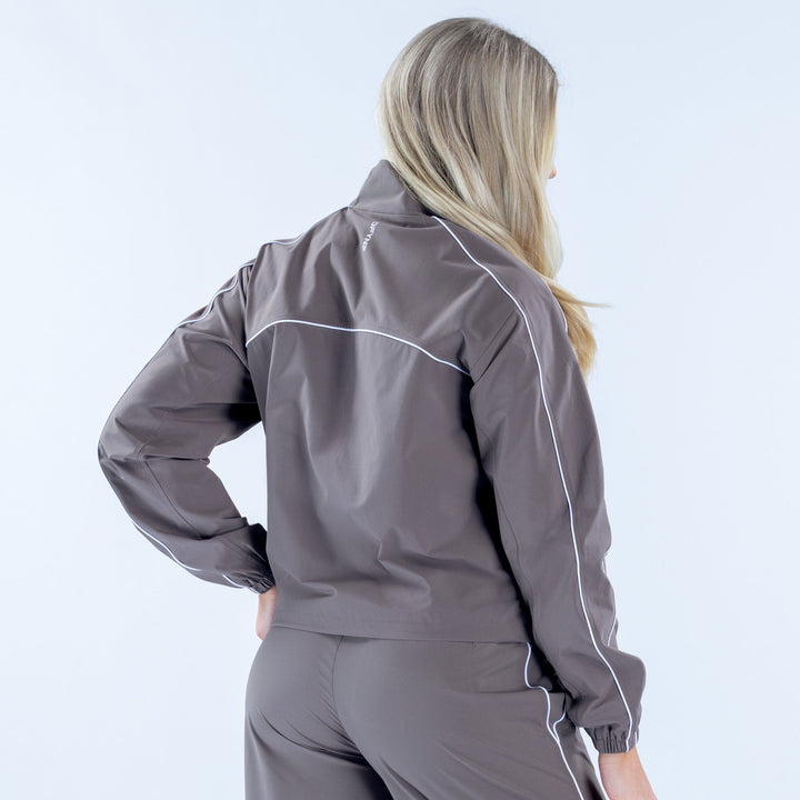 Women's gray track jacket back view, full-zip with white piping and elastic cuffs