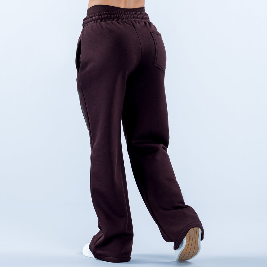Dark maroon wide-leg jogger pants with elastic waistband and side pocket, cuffed ankle hem